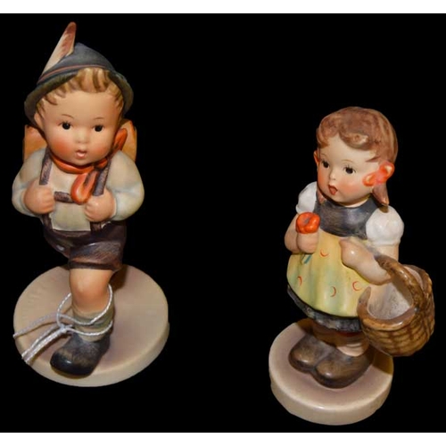 252 - Two Hummel Figurines 'Boy With Satchel' and 'Girl With Basket'