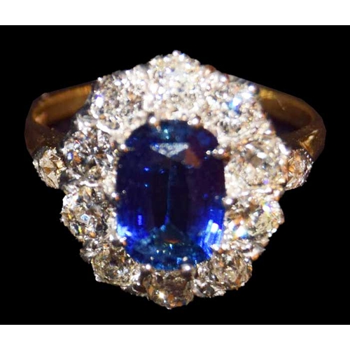 585 - An 18ct Gold Sapphire and Diamond Cluster Ring