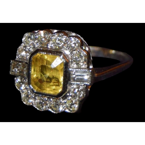 595 - A Platinum Yellow Sapphire and Diamond Cluster Ring