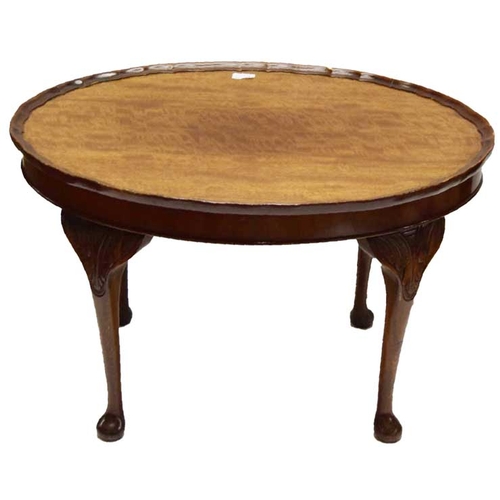 92 - An Oval Mahogany Coffee Table