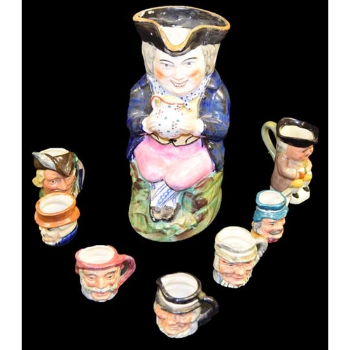 38 - A Large Toby Jug and Seven Smaller Jugs