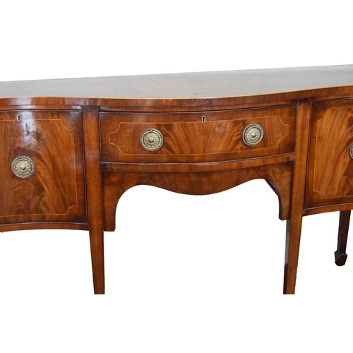 100 - An Inlaid Mahogany Serpentine Fronted Sideboard