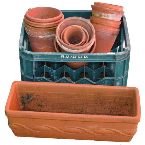 3 - A Rectangular Planter and a Box of Clay Pots