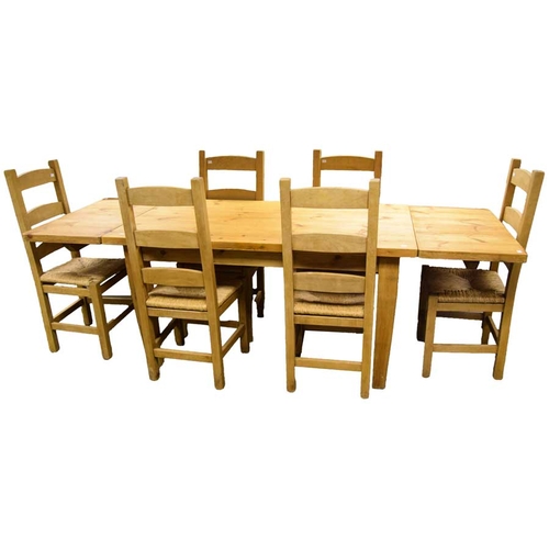 150 - A Very Good Extending Rectangular Pine Kitchen Table and Matching Six Chair Set with Rush Seats