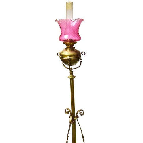 510 - A Brass Oil Filled Standard Lamp with Ruby Shade