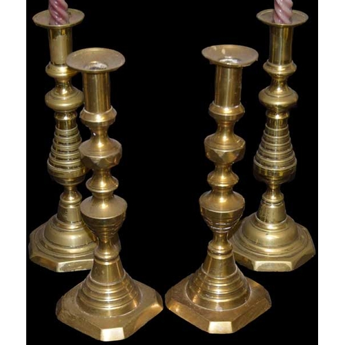 66 - Two Pairs of Brass Candlesticks