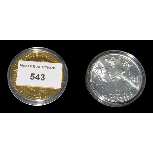 543 - A USA 125th Anniversary Coin and a 2003 USA One Ounce Silver Coin