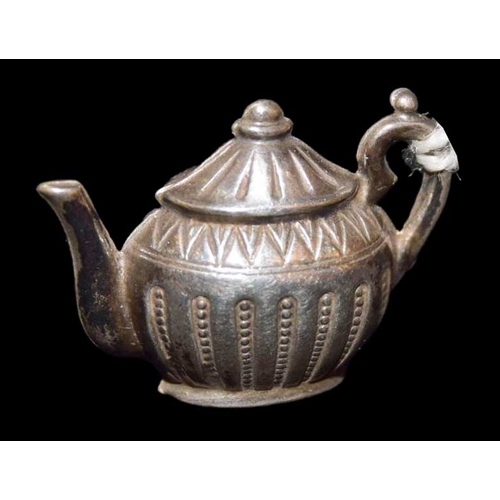 618 - A Miniature Silver Teapot