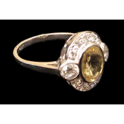 630 - A Platinum and Diamond Yellow Sapphire Ring