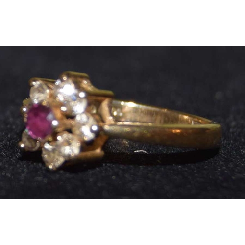 722 - A 9ct Gold Ruby and Cubic Zircona Cluster Ring