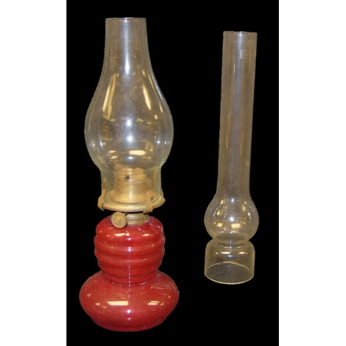 141 - A Ruby Glass Table Lamp and Extra Globe