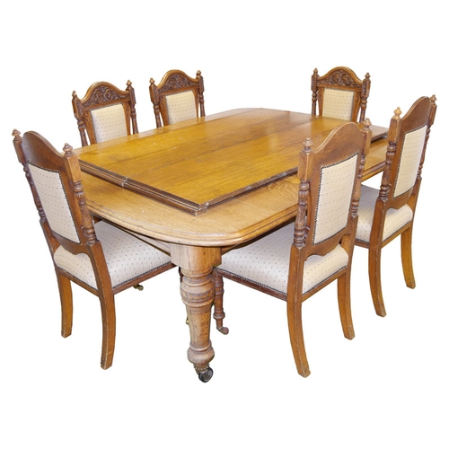 245 - A Very Good Oak Extending 'D' end Dining Room Table and a Set of 8 Matching Carved Back Oak chairs