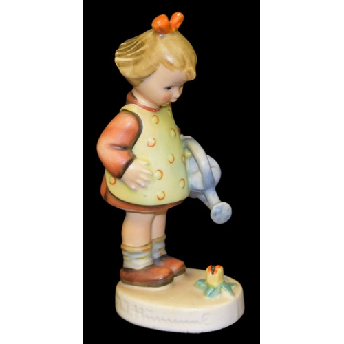 258 - A Hummel Figurine 'Girl with Watering Can'