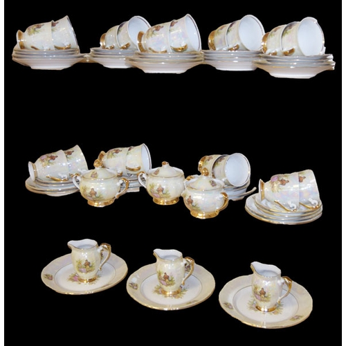 375 - A Large Decorative Teaset, Three Shelves