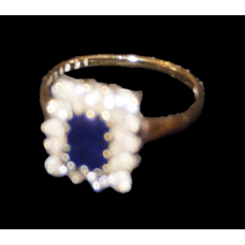 741 - A 9ct Gold Sapphire and Cubic Zircona Ring