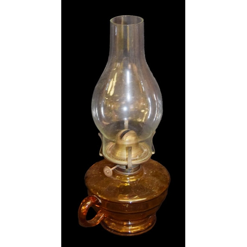 239 - An Amber Glass Finger Lamp