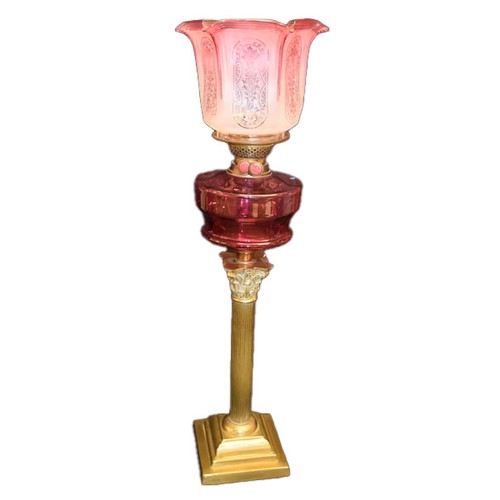 320A - A Corinthian Based Pillar Oil Lamp, Ruby Bowl and Shade