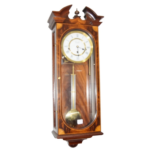 41 - A Modern Rosewood Cased Wall Clock by Comitti of London