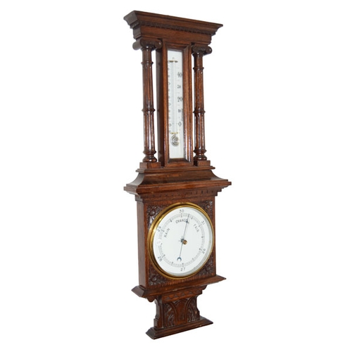 48 - An Antique Carved Oak Aneroid Barometer