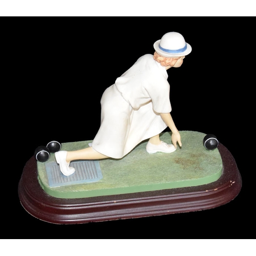 61 - A Porcelain Figurine ' Lady Bowler'