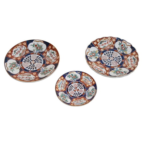 94 - Three 20th Century Imari Plates