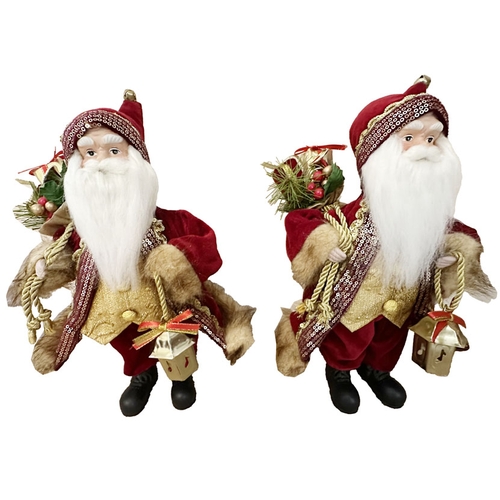 16 - Two Santa Claus Figurines