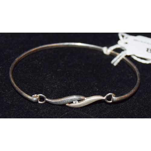 819 - A Silver and Cubic Zircona Bangle