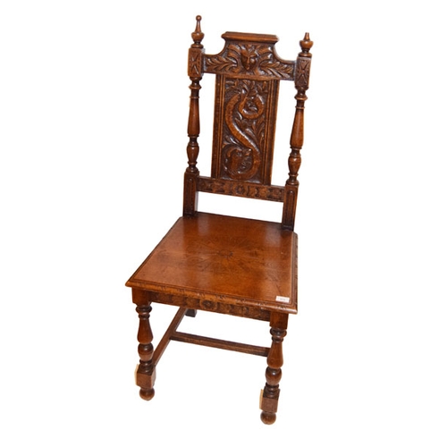 513 - A Carved Oak Hall Chair