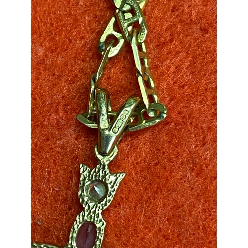 49 - 9ct gold chain and crucifix, featuring CZ's and purple stones (possibly amethyst) 8.5g total weight