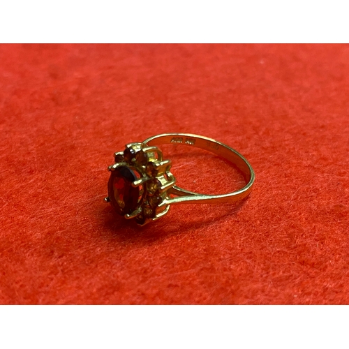 50 - 14ct gold ring size P featuring red stones, possibly ruby