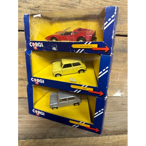 148 - 3 x Boxed Corgi cars including 2 Minis and a Ferrari.