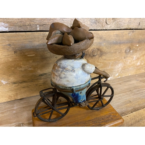 271 - Rodo Padilla Metal and Ceramic Mexican Folk Art Sculpture of a Man on a Bicycle. Small chip on head