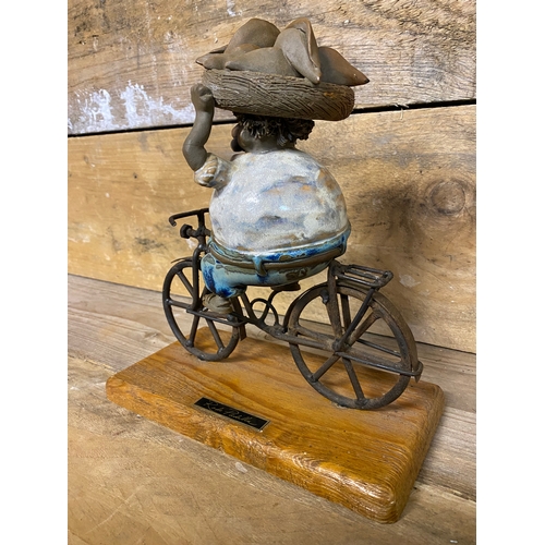 271 - Rodo Padilla Metal and Ceramic Mexican Folk Art Sculpture of a Man on a Bicycle. Small chip on head