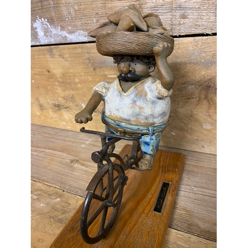 271 - Rodo Padilla Metal and Ceramic Mexican Folk Art Sculpture of a Man on a Bicycle. Small chip on head