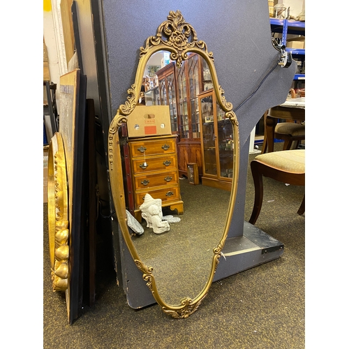 436 - Ornate Gilt Metal Framed Shield Mirror 108 x 50cm, condition issues