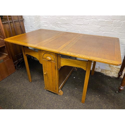 495 - Heavy Drop Leaf Dining Table with Twin Fold out Legs, Side Drawer and Cupboard