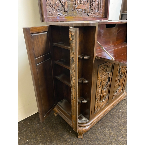 517 - Heavily Carved and Polished Oriental Wooden Drinks Cabinet