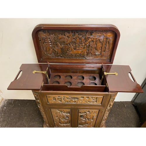 517 - Heavily Carved and Polished Oriental Wooden Drinks Cabinet