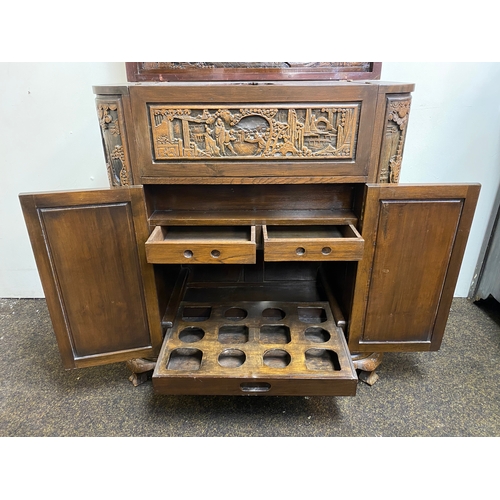 517 - Heavily Carved and Polished Oriental Wooden Drinks Cabinet