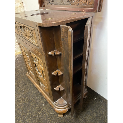 517 - Heavily Carved and Polished Oriental Wooden Drinks Cabinet