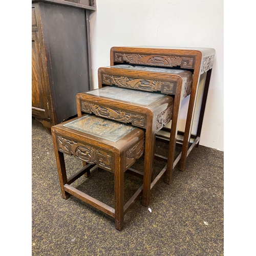 522 - Set of 4 Heavily Carved Wooden Oriental Stacking Tables with Glass Tops