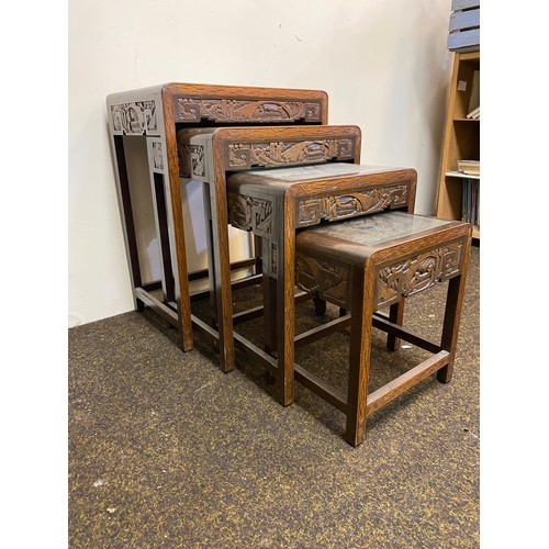 522 - Set of 4 Heavily Carved Wooden Oriental Stacking Tables with Glass Tops