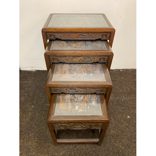 522 - Set of 4 Heavily Carved Wooden Oriental Stacking Tables with Glass Tops