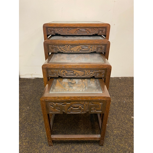 522 - Set of 4 Heavily Carved Wooden Oriental Stacking Tables with Glass Tops