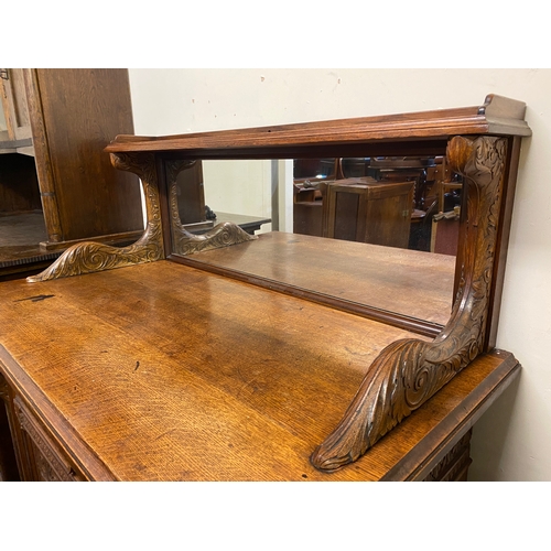 535 - Heavily Carved Solid Oak Sideboard of Grand Proportions, Front lock replaced with catch