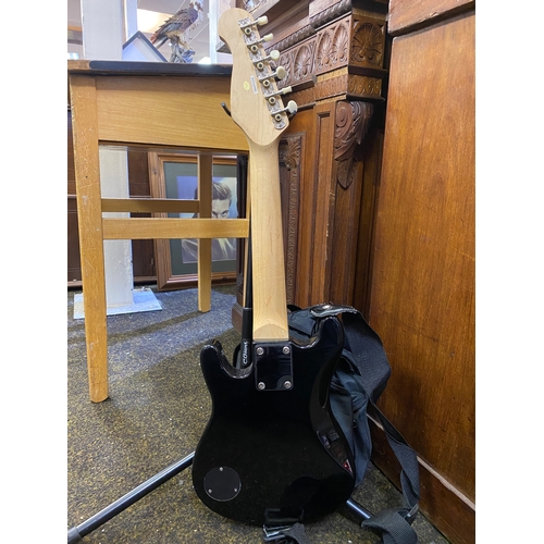 82 - Childs Electric Guitar, Bag and Stand with Spare strings, fully working