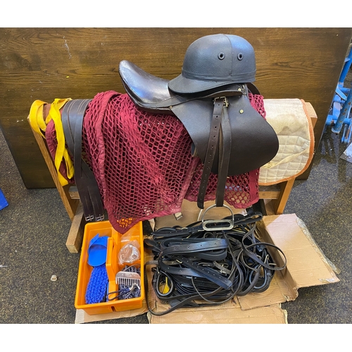 151 - Collection of Childs Riding Equipment including Grooming kit, Tack and Tack Stand