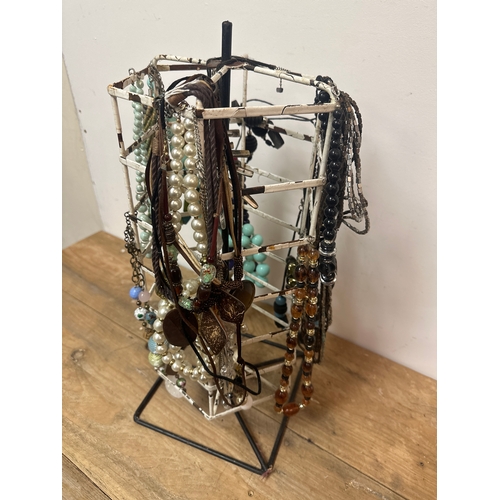 60 - Costume jewellery and stand