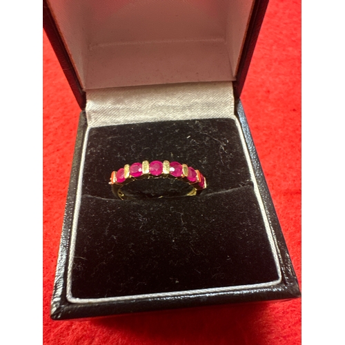 23 - Ladies 9ct Gold Ring with Red Stones Size N