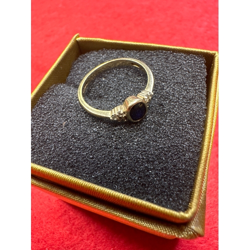 32 - Ladies 9 ct Gold Ring with sapphire and 6 small Diamonds size N